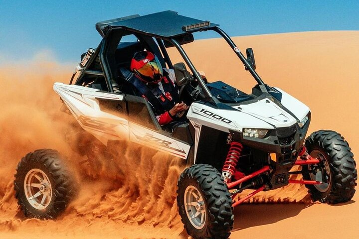 Conquer the stunning red dunes of Dubai in a Polaris Dune Buggy guided by experts. Enjoy an action-packed hour of dune bashing ample photo spots and refreshing drinks.
